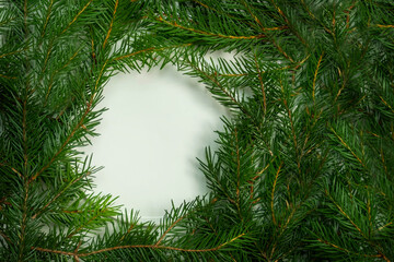 spruce twigs are laid out on a white background with a place for the text mockup, the concept of the new year