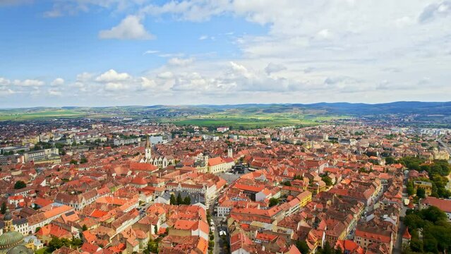 Aerial drone view of Cluj centre, Romania. Cityscape, roads with cars, old buildings, Saint Michael Church