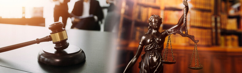 Fototapeta na wymiar Judge gavel with Justice lawyers having team meeting at law firm in background. Concepts of law.