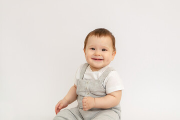 portrait of a little baby boy on a white background copy space. cute happy little redhead boy smiling. happy child