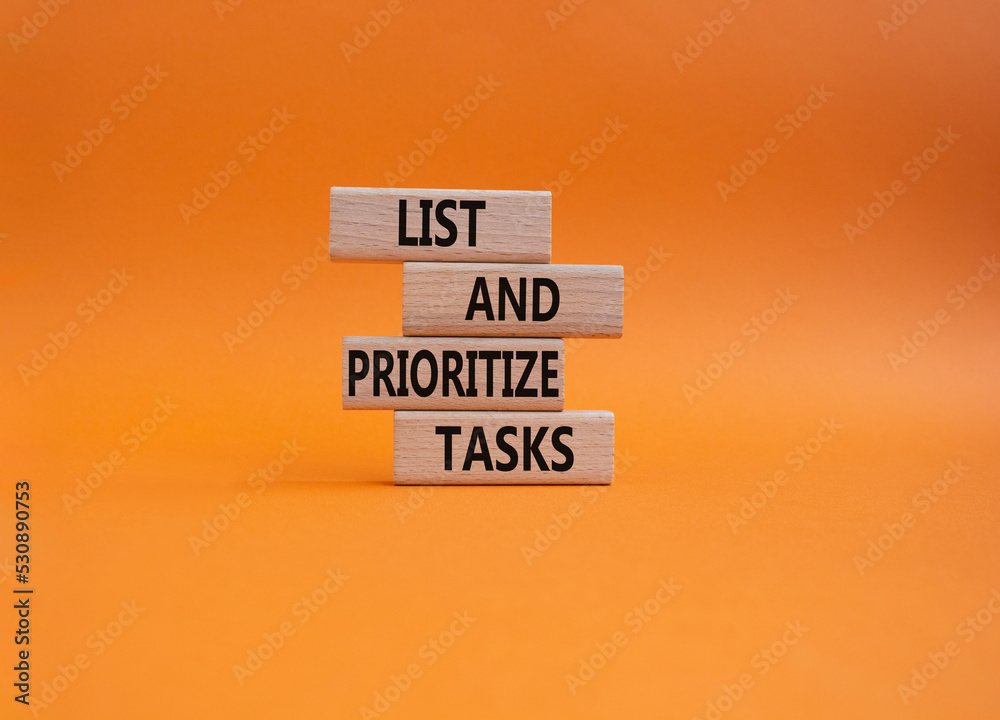 Wall mural list and prioritize tasks symbol. concept words list and prioritize tasks on wooden blocks. beautifu