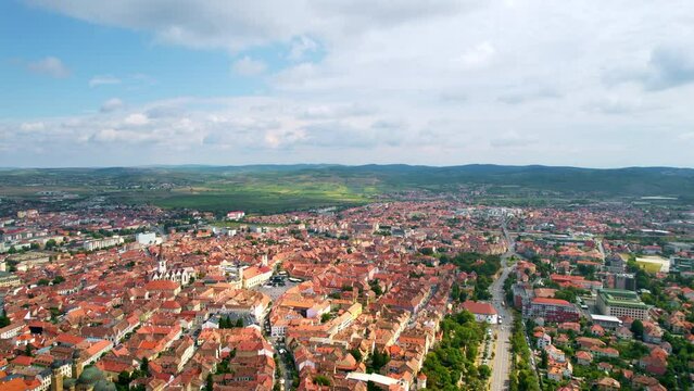 Aerial drone view of Cluj centre, Romania. Cityscape, roads with cars, old buildings, Saint Michael Church