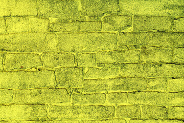 Stone wall of the old temple. Yellow abostract background of stone.