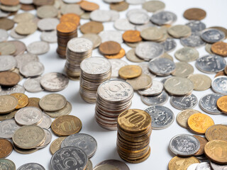 Close-up of a lot of Russian ruble coins on a white background. Columns of coins. The concept of the economy of growth, development. Budget, currency. Risks, banks