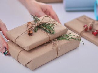 Hands of woman holding christmas gift box.