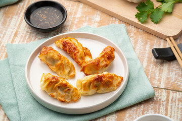 Airfryer gyoza,Use Air Fryer grilled dumplings pork and vegetables on white plate