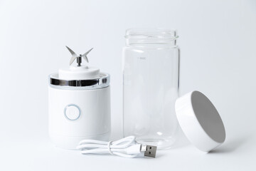 Portable mini blender for making smoothie isolated on white background.