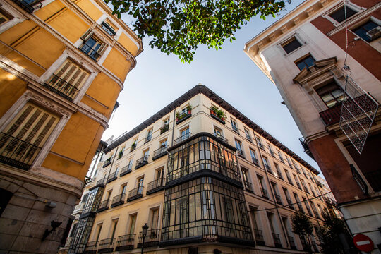 Exterior view of colorful historical buildings in Central Madrid, Spain, Europe. Traditional European street scene in the Chueca neighborhood of the Spanish capital.
