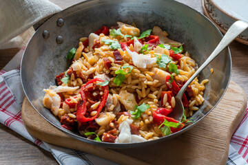 Cod, chorizo and orzo pasta with roasted red peppers