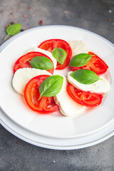 caprese saladmozzarella basil tomato fresh dish healthy meal food snack on the table copy space food background  