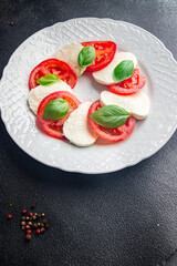 caprese saladmozzarella basil tomato fresh dish healthy meal food snack on the table copy space food background  