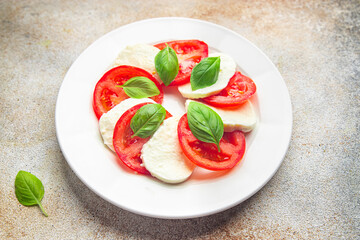 caprese saladmozzarella basil tomato fresh dish healthy meal food snack on the table copy space food background  