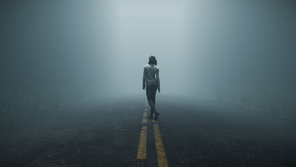 Woman walking alone down foggy road in forest