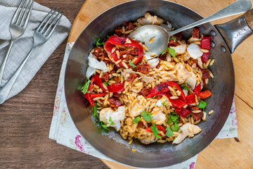 Cod, chorizo and orzo pasta with roasted red peppers