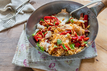 Cod, chorizo and orzo pasta with roasted red peppers