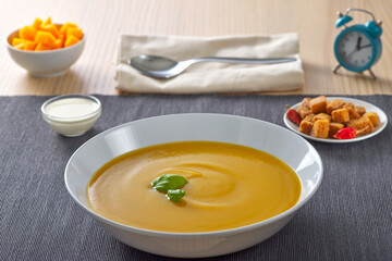 Pumpkin traditional soup with croutons