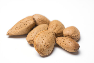 almonds in the peel isolated on a white