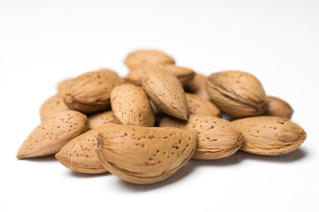 almonds in the peel isolated on a white