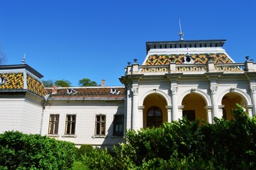 an old castle with white pillars
