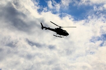 Fototapeta na wymiar Silhouette of a rotary helicopter 