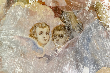frescoes on the walls of an abandoned temple, angels