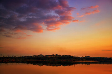 Fototapeta na wymiar Sunset on the lake with reflection