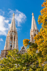 Towers of Votivkirche church in autumn, Vienna, Austria