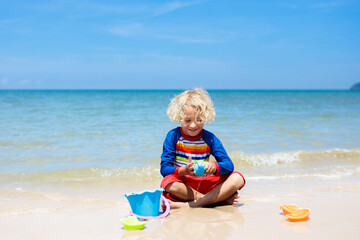 Kids playing on beach. Children play at sea.