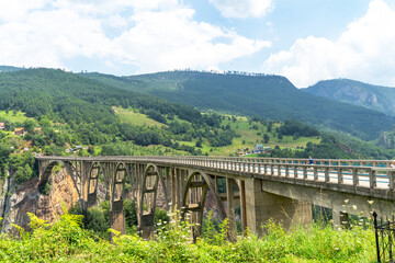 Fototapeta na wymiar Concrete arch Djurdjevica Tara bridge over the Tara River in Montenegro
