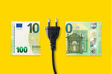 Euro banknote on a yellow background. Energy crisis and expensive electricity, gas price. Big heating, gas and electricity bill - obrazy, fototapety, plakaty