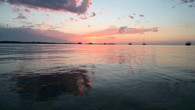 Sunset at the sea. Tropical sunset with dramatic sky with clouds. Orange clouds on horizon. Brijuni Islands, Istria, Adriatic sea, Croatia. 