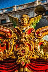 Detail of the decorative figure of an angel adorning a carousel in Florence. The amazing capital of the Italian Renaissance. Oil paint filter.