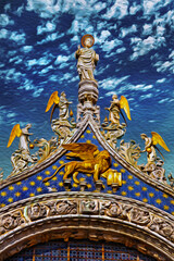 Sculptures and frontispiece made in marble and gold on the San Marco Basilica in Venice. The historic and amazing city in Italy. Oil paint filter.