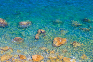 Very beautiful background or backdrop of sea water with rocky shore, selective focus