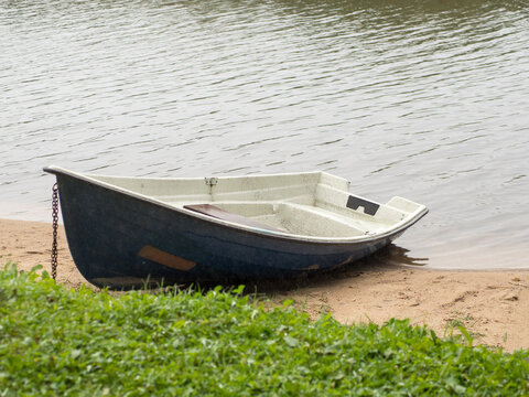 old boats on the sandy shore. wooden boat on the sand by the lake