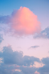 pink cloud in the sunset sky of an abstract and conceptual paradise