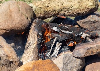 Photograph of a bonfire prepared for a barbecue.