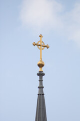 Fototapeta na wymiar cross on the roof of a church