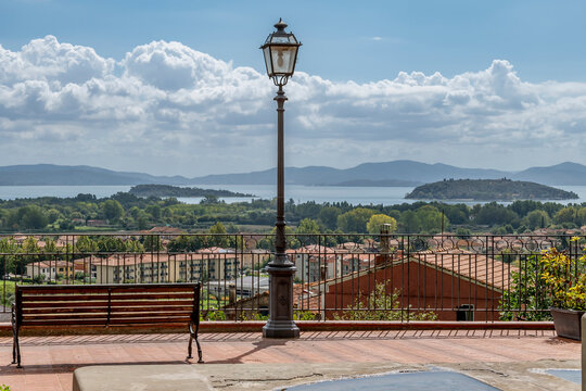 Panoramic view of Lake Trasimeno from a terrace in the historic center of Tuoro sul Trasimeno, Perugia, Italy