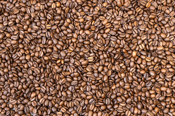 Background of coffee beans. Roasted coffee beans can be used as a background.