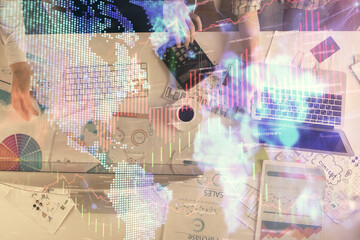 Obraz premium Multi exposure of man and woman working together and financial chart hologram. Business concept. Computer background.