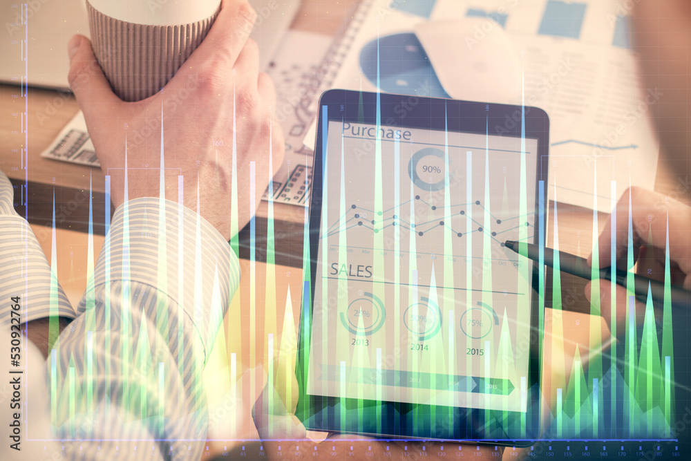 Aufkleber double exposure of man's hands holding and using a phone and financial chart drawing. market analysi