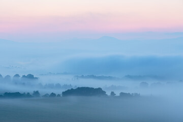 Morning view of Bystricka village shrouded in fog, Slovakia.