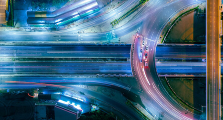 Hyperlapse time-lapse of car traffic transportation above circle roundabout road in Asian city....