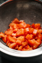 Straining Diced Tomatoes for a salad
