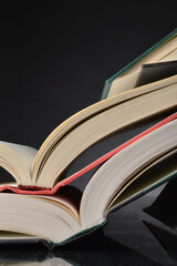 Stack of numerous open books