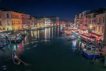 Fototapeta premium Ornate Gondolas in Grand Canal at illuminated night, Venice, Italy