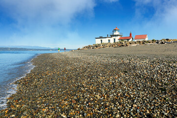West Point Light House  also known as the Discovery Park Lighthouse on a sunny day. The lighthouse is an active aid to navigation on Seattle, Washington's West Point.