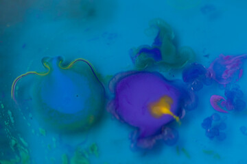 Colorful abstract art, in the form of aquatic beings. Blue background