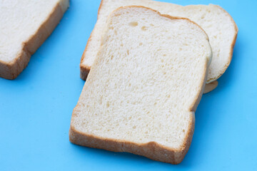 Sliced bread on blue background.